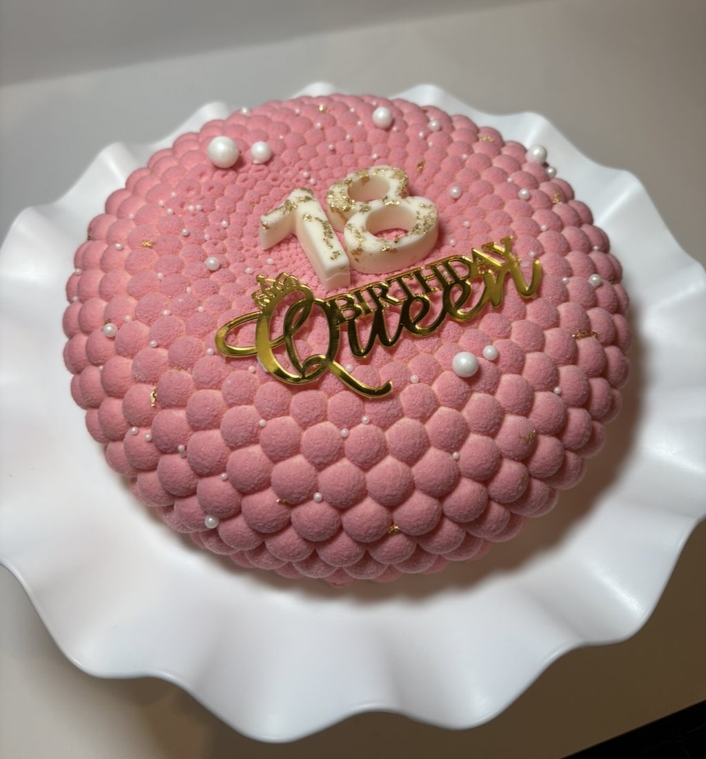 Pink bubble textured mousse cake with 18th Birthday Queen topper