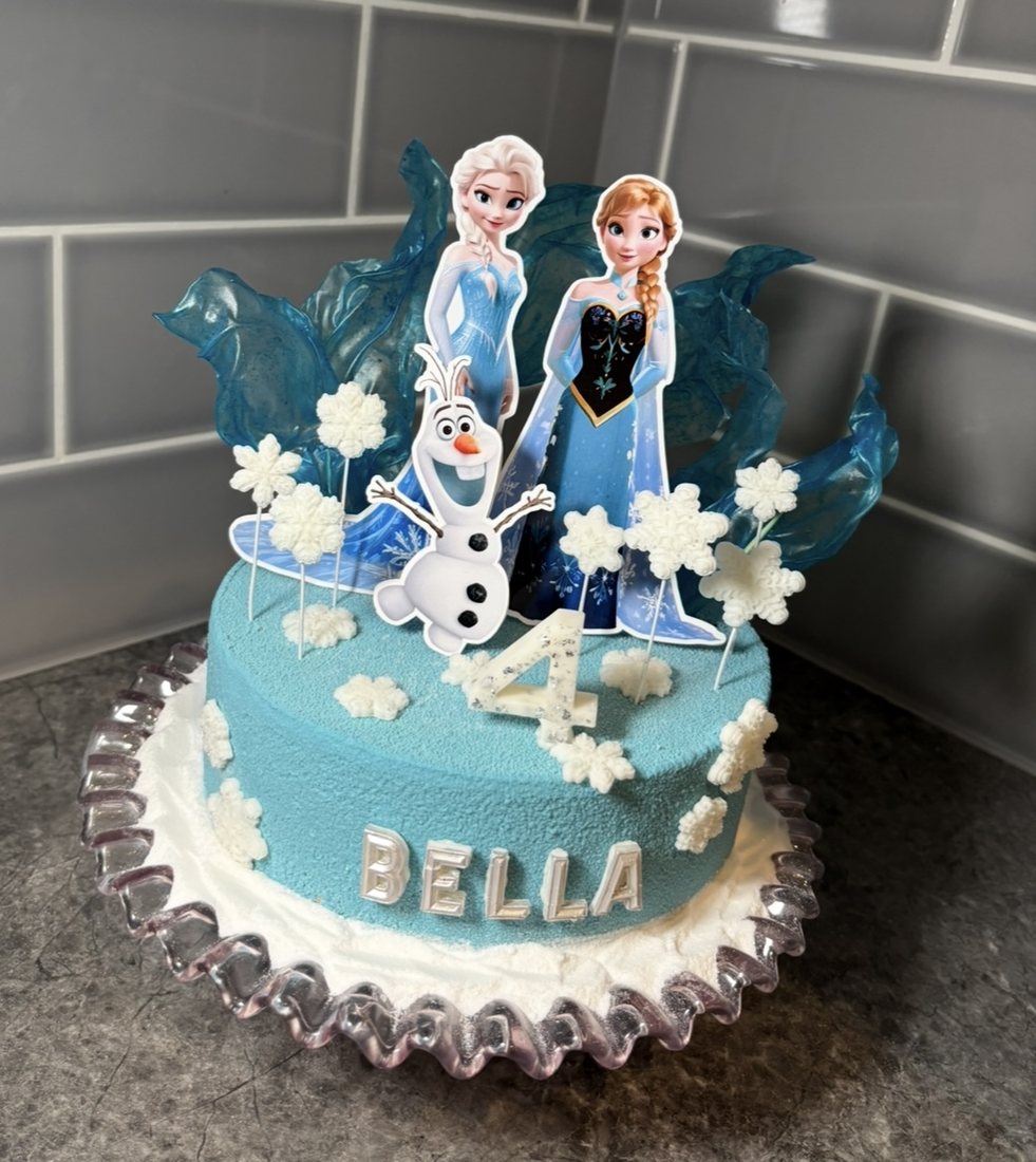 Frozen themed cake with Elsa, Anna and Olaf toppers