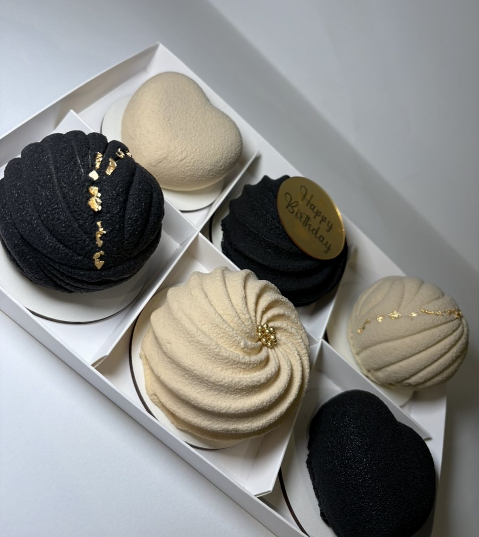 Black and cream mousse cake box of six with gold leaf