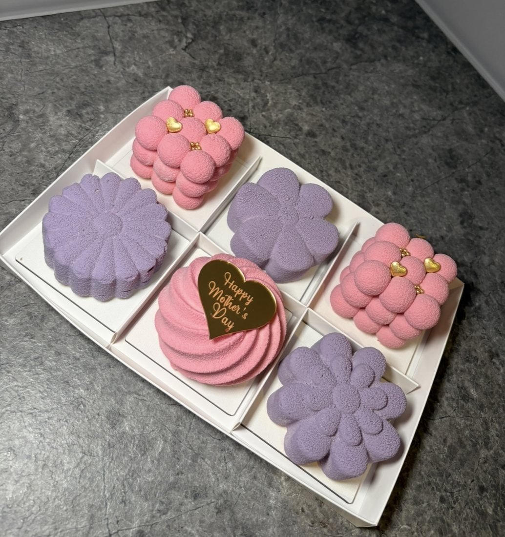 Set of six pink and lilac Mother's Day mousse cakes