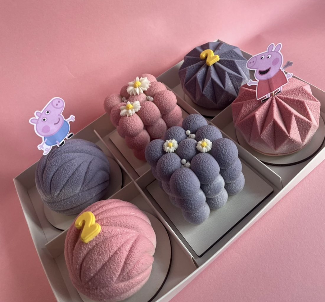 Purple and pink mousse cakes with Peppa Pig decorations for a 2nd birthday