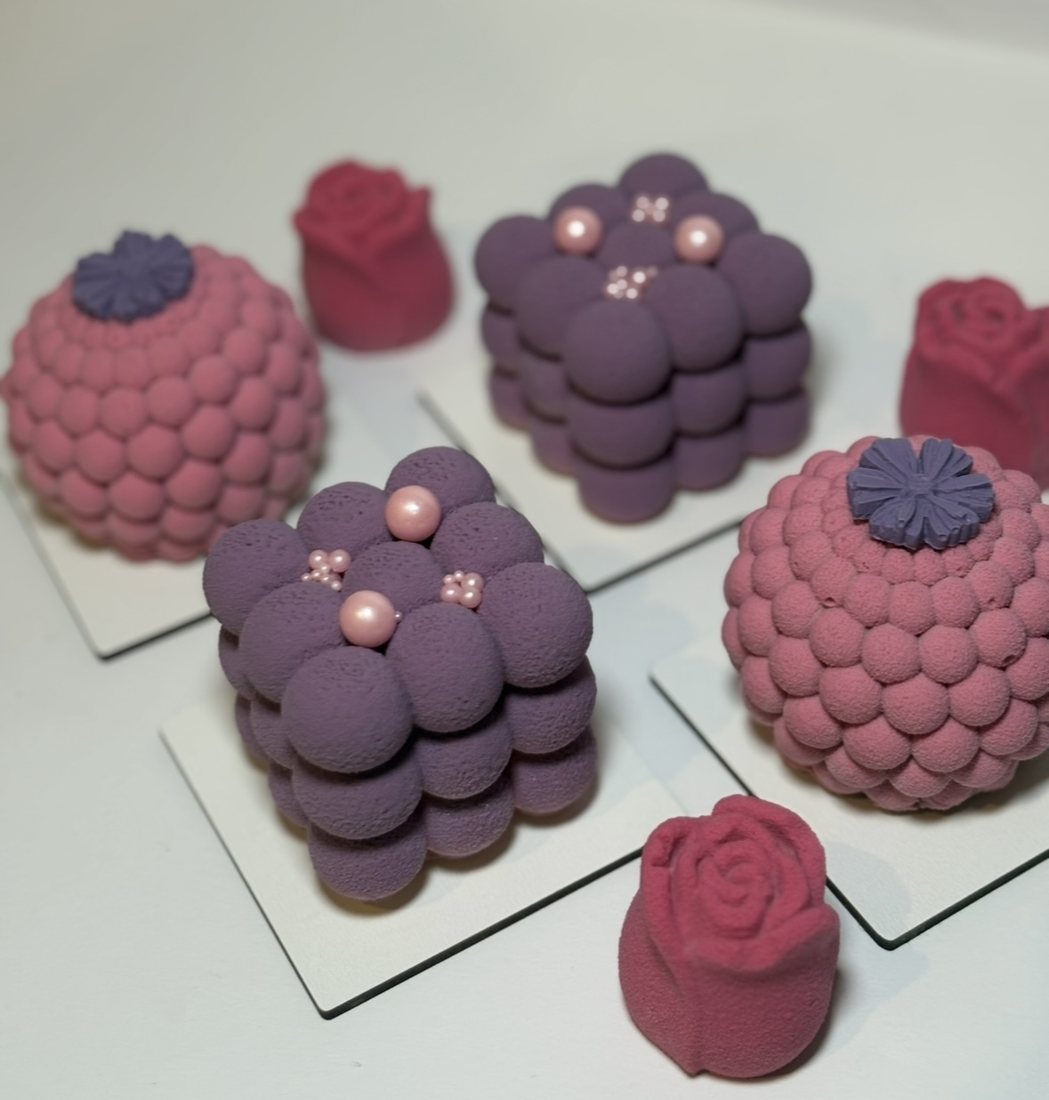 Purple and pink bubble textured mousse cakes with rose shaped mousse cakes