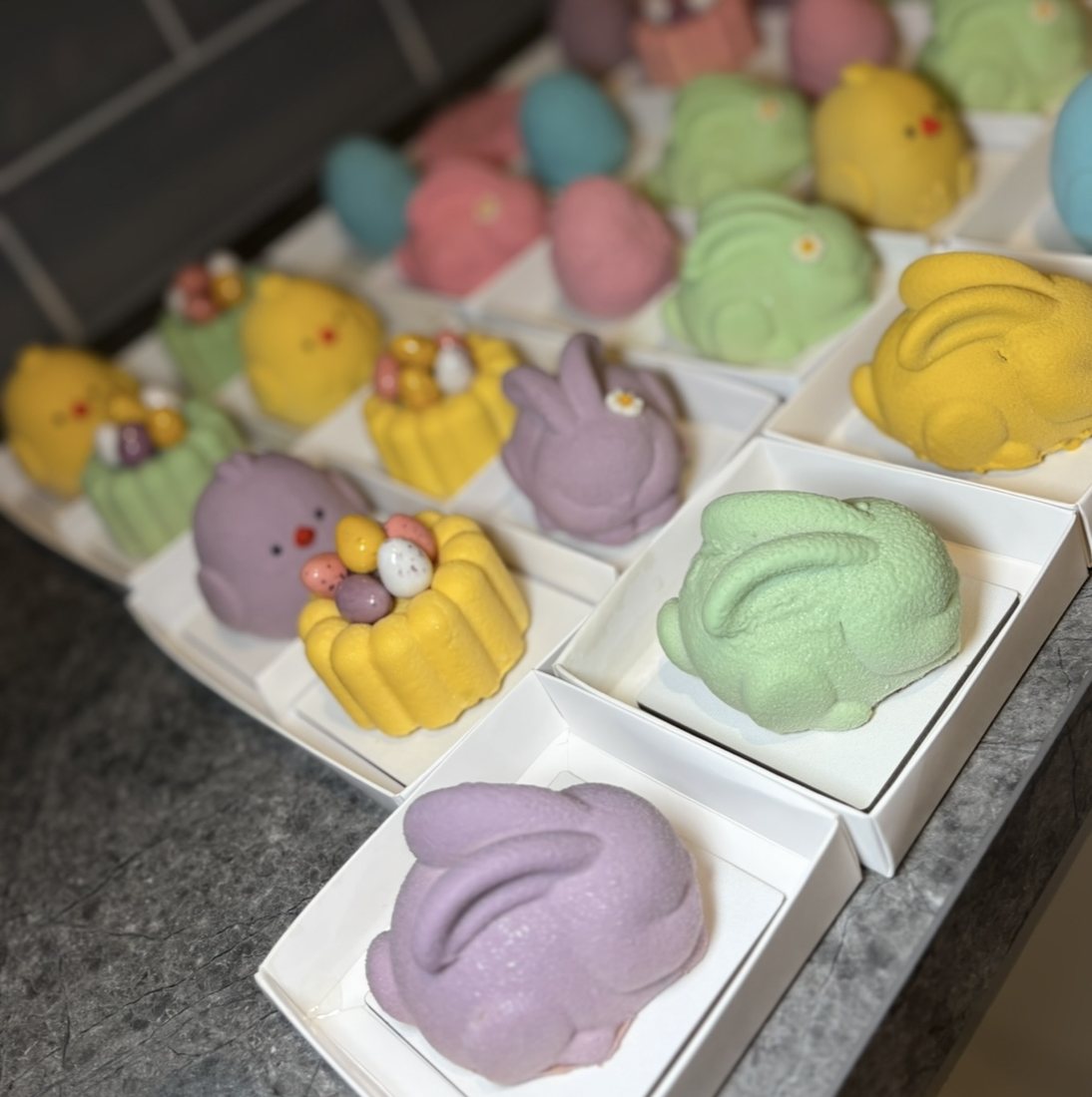 Pastel bunny and chick shaped mousse cakes for Easter, wide assortment