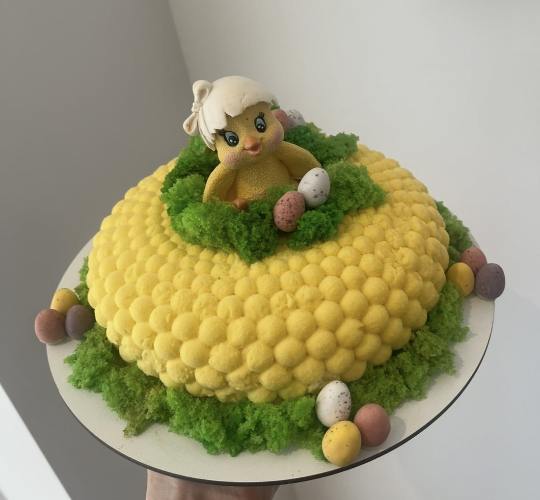 Yellow bubble textured mousse cake with an Easter chick topper